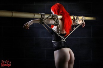 Model Deadlydoll tied to bamboo tube - Fine Art of Bondage