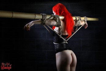 Model Deadlydoll tied to bamboo tube - Fine Art of Bondage